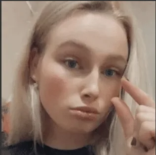 Close up beauty portrait of a young female creator pointing to her eye, social media content by The Bunny Agency